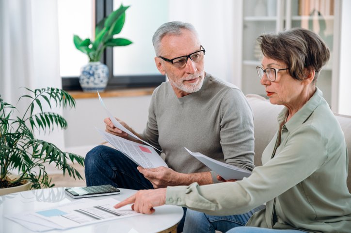A couple comparing ETFs.