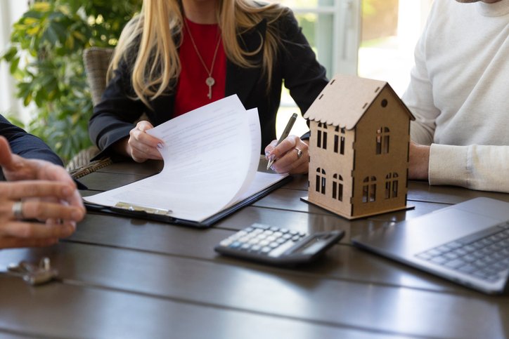A homebuyer meeting with a real estate agent.