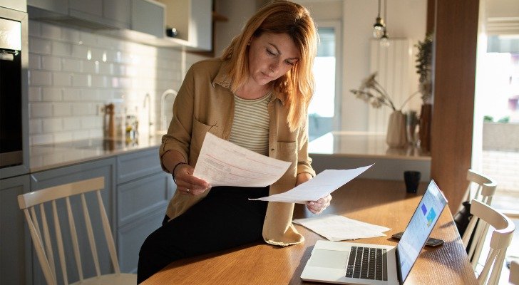 A landlord reviewing her rental income.
